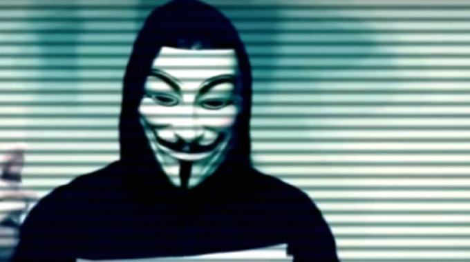 a black hoodie and mask clad anonymous member